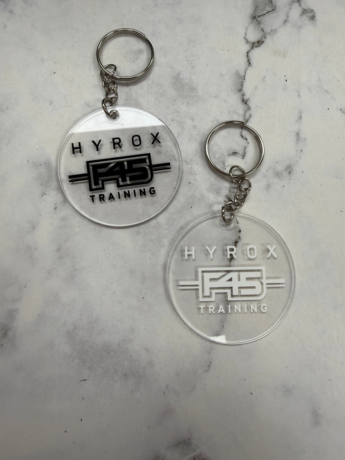 H**** F45 Training Round Keychain