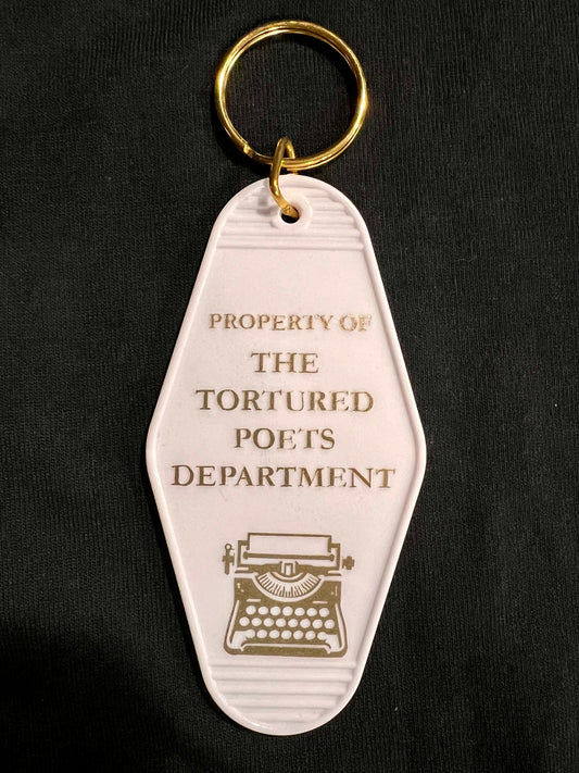 property of motel style keychain