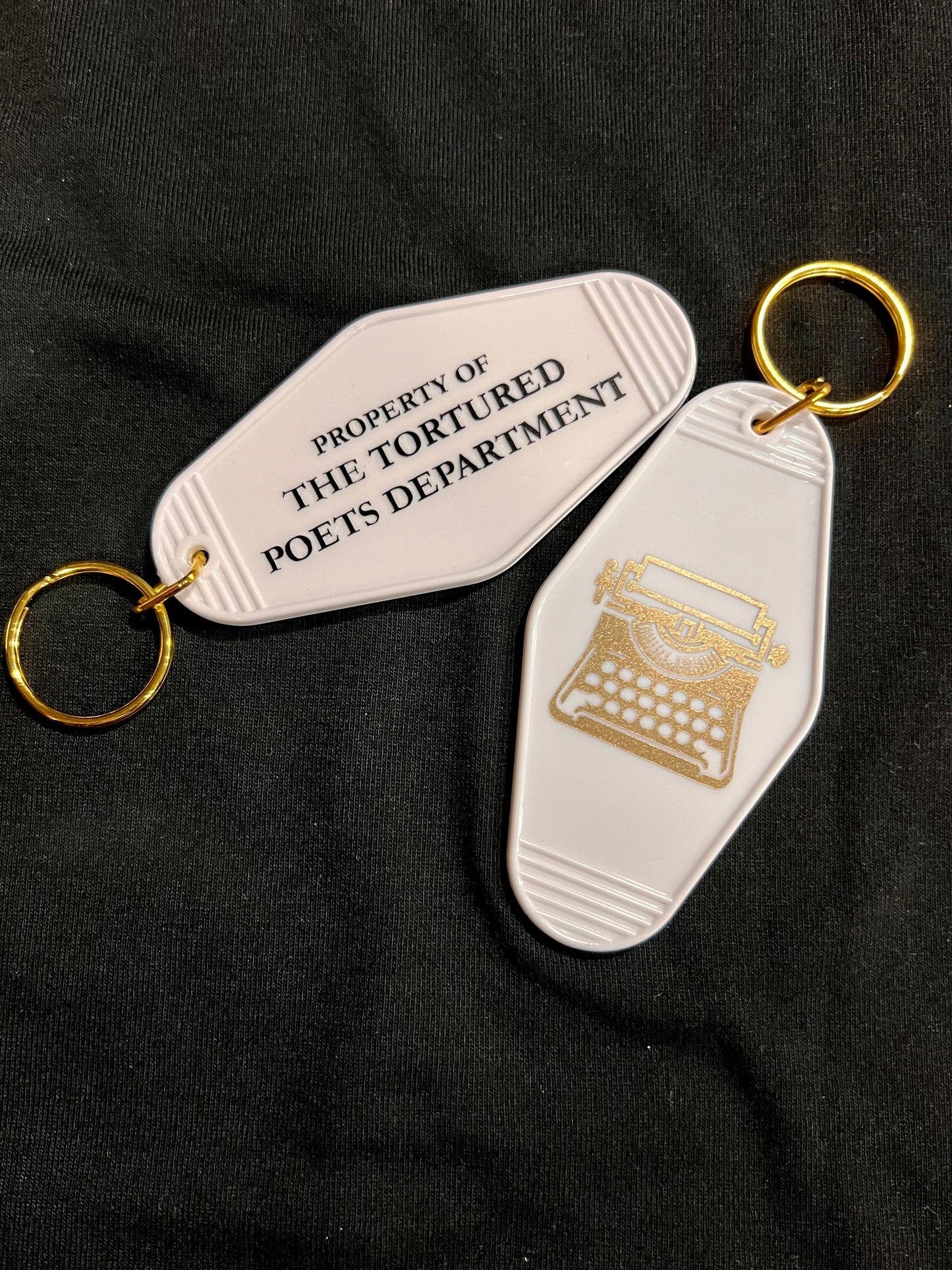 property of motel style keychain