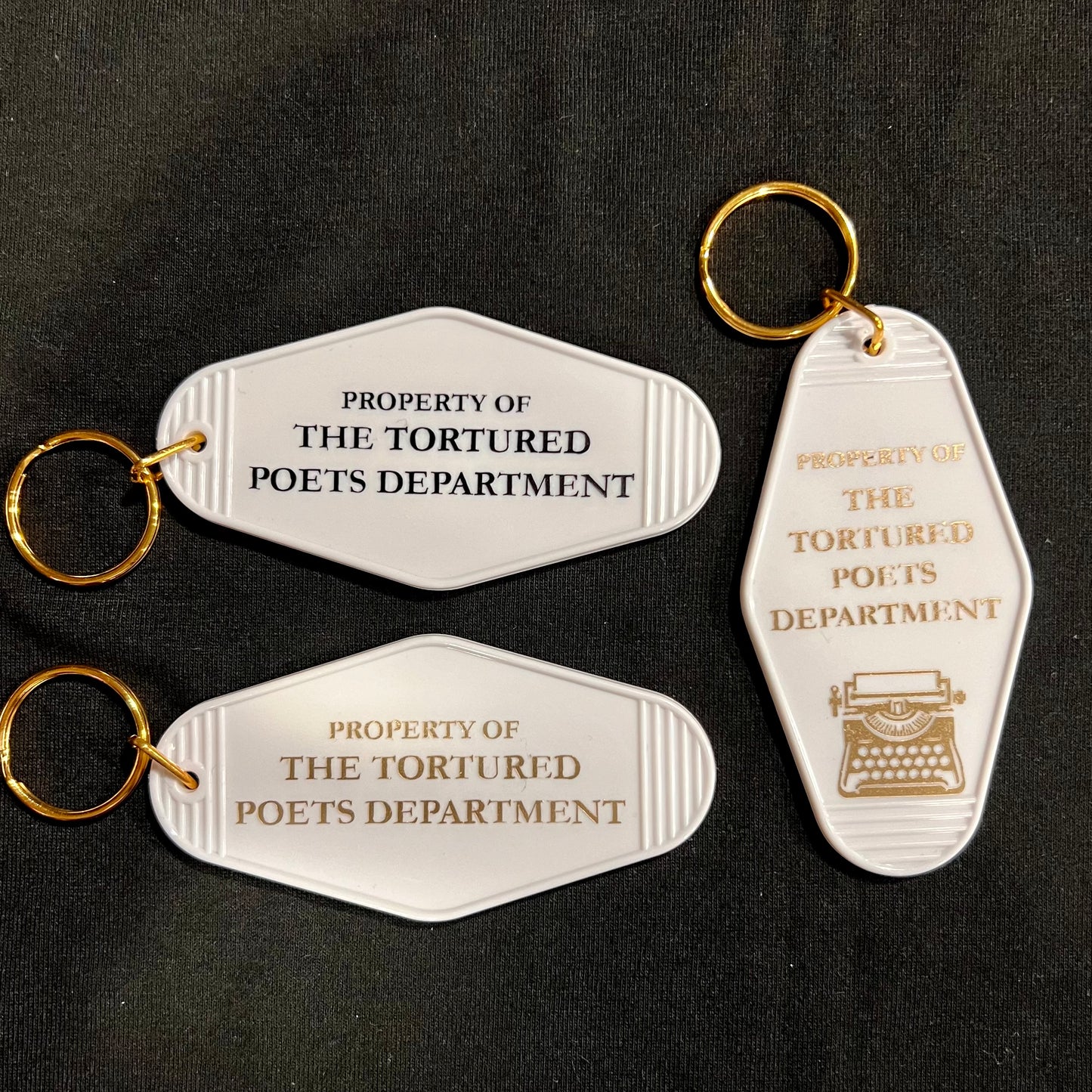 property of motel style keychain