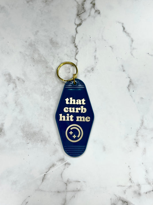 That curb hit me motel style keychain