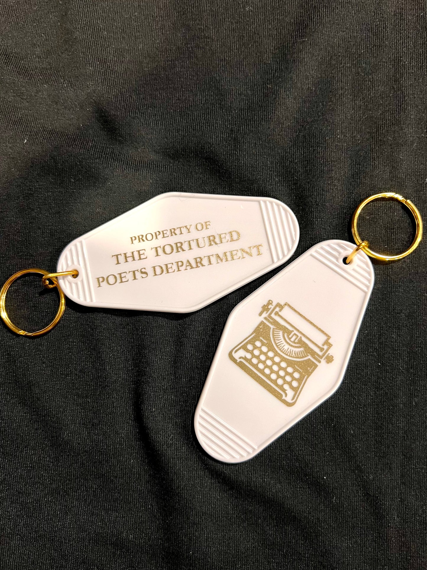 property of motel style keychain