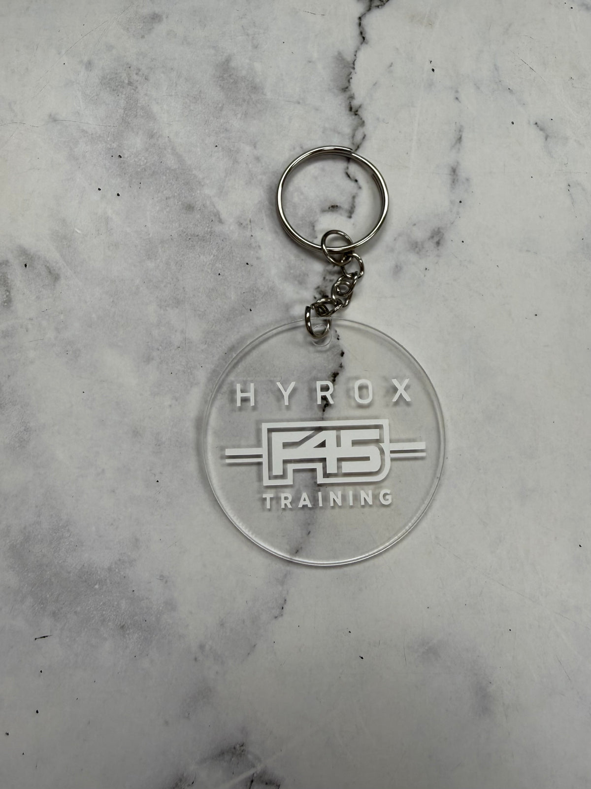 H**** F45 Training Round Keychain