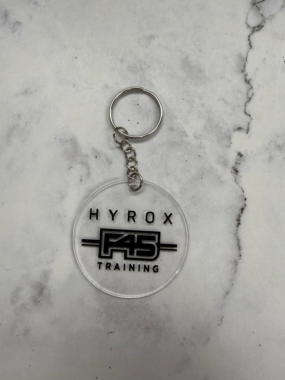 H**** F45 Training Round Keychain