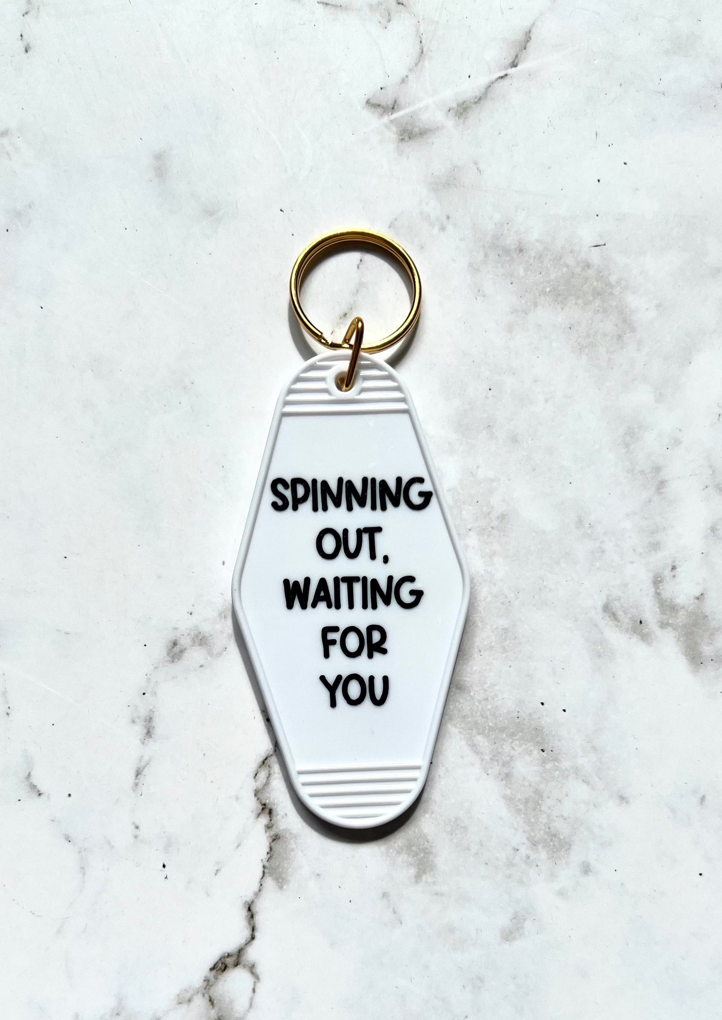 Spinning Out motel style keychain