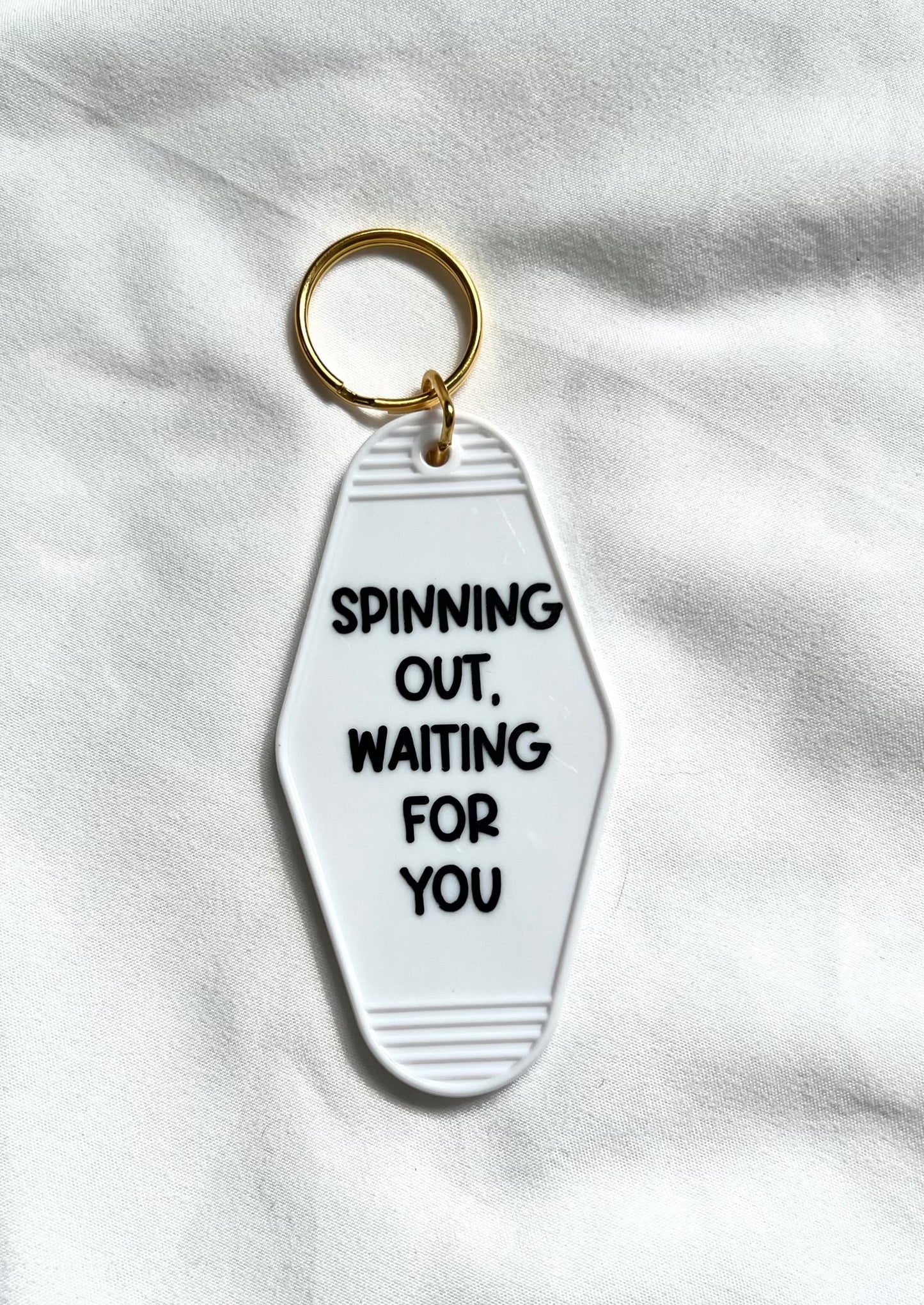 Spinning Out motel style keychain